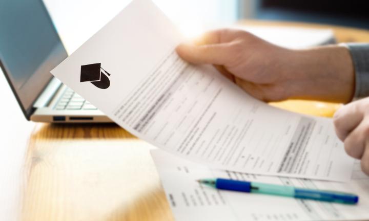 Student looks at application paperwork