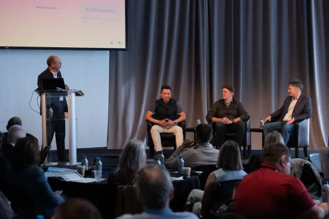 MIT Researchers and partners talking on stage